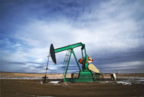 An oil pump jack at a drilling site for oil, an oil field